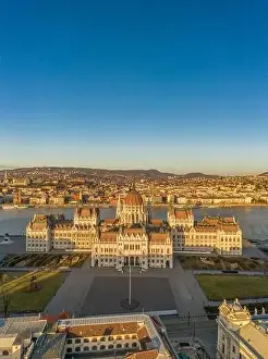 Morning Glow Prints: Aerial drone shot of east side facade of Hungarian Parliament Kossuth Square during Budapest sunrise