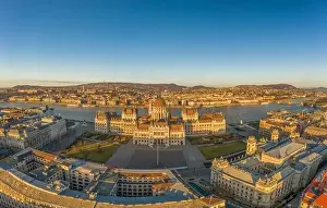 Morning Glow Prints: Aerial drone shot of east side facade of Hungarian Parliament Kossuth Square during Budapest sunrise