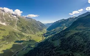 Tirol Prints: Aerial drone shot of Grossglockner mountain range valley in summer in Austria