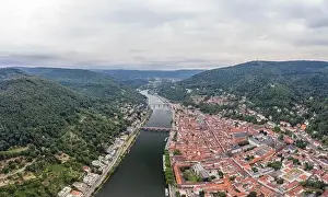 Heidelberg Prints: Aerial drone shot of Heidelberg old town in overcast at foot of Konigstuhl mountain