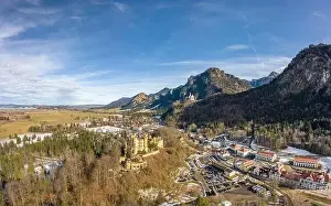 Snow Mountain Prints: Aerial drone shot of Hohenschwangau in Fussen with view of Neuschwanstein castle in Germany winter