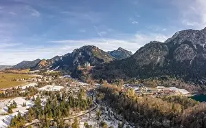 Fussen Prints: Aerial drone shot of Hohenschwangau in Fussen with view of Neuschwanstein castle in Germany winter