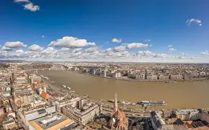 Morning Glow Prints: Aerial drone shot of Hungarian Parliament with clouds by Danube in Budapest Winter morning