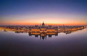 Morning Glow Prints: Aerial drone shot of Hungarian Parliament lights off before sunrise in Budapest dawn