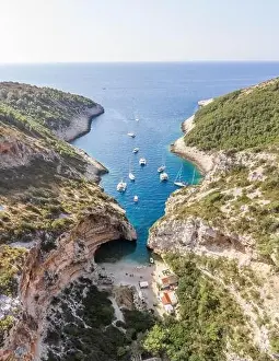 Aerial drone shot of iconic Stiniva cove beach of Adriatic sea on Vis Island in Croatia summer