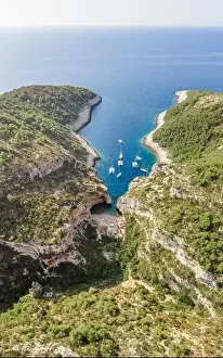 Aerial drone shot of iconic Stiniva cove beach of Adriatic sea on Vis Island in Croatia summer