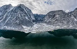 Northern Limestone Alps Prints: Aerial Drone shot of Lahn village by Hallstatt lake at foot of Austrian Alps mountain with clouds in winter