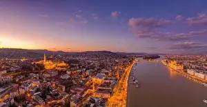 Beautiful Sky Prints: Aerial drone shot of lighted Matthias Churh Fisherman's Bastion on Buda Hill in Budapest sunset time