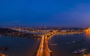 Buda Prints: Aerial drone shot of Margaret Bridge with lights on over Danube river during Budapest sunset