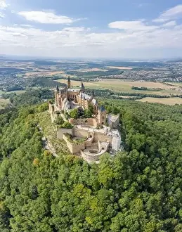 Baden Wurttemberg Prints: Aerial drone shot of Medival Hohenzollern Castle on hill near Stuttgart at summer noon