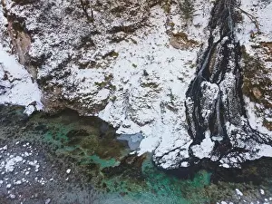 Forest Trees Prints: Aerial drone shot of snowy and icy winter landscape in the oetschergraeben