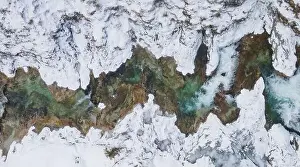 Forest Trees Prints: Aerial drone shot of snowy and icy winter landscape in the oetschergraeben