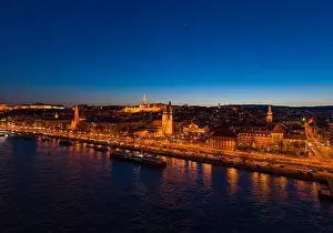 Beautiful Sky Prints: Aerial drone shot of St. Anne Parish church by Danube river at Budapest dusk city lights