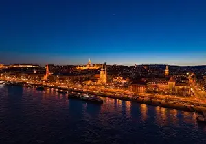 Beautiful Sky Prints: Aerial drone shot of St. Anne Parish church by Danube river at Budapest dusk city lights
