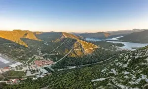 Aerial drone shot of Ston city wall over hill in Ragusa region near Dubrovnik in Croatia summer sunrise