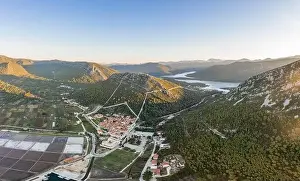 Aerial drone shot of Ston city wall over hill in Ragusa region near Dubrovnik in Croatia summer sunrise