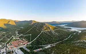 Ragusa Prints: Aerial drone shot of Ston city wall over hill in Ragusa region near Dubrovnik in Croatia summer sunrise