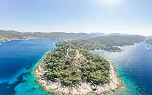 Aerial drone shot of stone Fort George Croatia on top of hill in Adriatic sea on Vis Island in summer