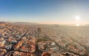 Gaudi Prints: Aerial drone shot of sunrise over Barcelona city center in early morning