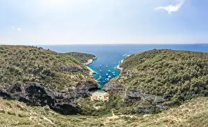 Covert Prints: Aerial drone shot of tourists relax at Stiniva cove beach Adriatic on Vis Island in Croatia summer