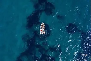 Gods View Prints: Aerial drone shot view of a boat in Ionian sea near Zakynthos Island