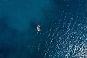Gods View Prints: Aerial drone shot view of a boat in Ionian sea near Zakynthos Island