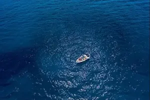 Gods View Prints: Aerial drone shot view of a boat in Ionian sea near Zakynthos Island