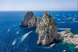 Sea Stacks Prints: Aerial drone shot view of faraglioni limestone crags in summer time in Tyrrhenian sea off Capri Island