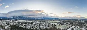 Magic Hour Prints: Aerial drone shot view of outskirts and austrian alps untersberg with heavy fog in winter