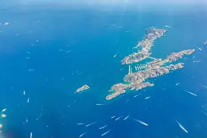 Aerial drone shot view of yachts between Ile Sainte Marguerite and Ile Saint Honorat in mediterranean sea
