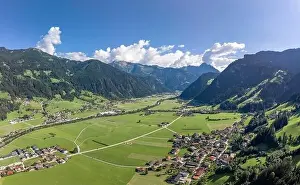 Aerial drone shot of Zillertal valley with clouds in Tyrol Austria summer