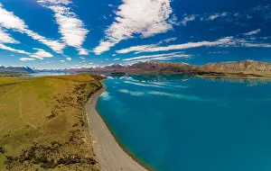 Aoraki Prints: Aerial drone shots of beautiful Lake Tekapo with reflection of sky and mountains