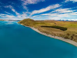 Aoraki Prints: Aerial drone shots of beautiful Lake Tekapo with reflection of sky and mountains