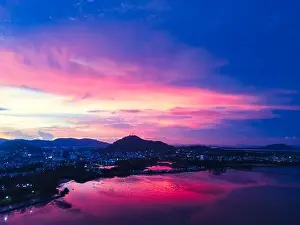 Moutain Prints: Aerial drone view beautiful twilignt sky after sunset over bay and town