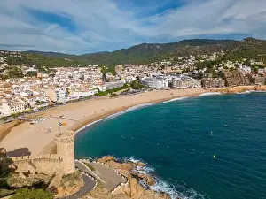 Costa Brava Prints: Aerial drone view of the coastal town named Tossa de Mar with a beach and castle