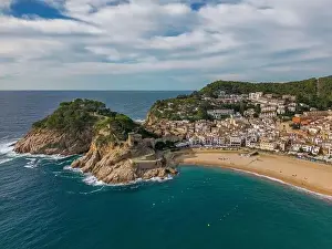 Costa Brava Prints: Aerial drone view of the coastal town named Tossa de Mar with a beach and castle
