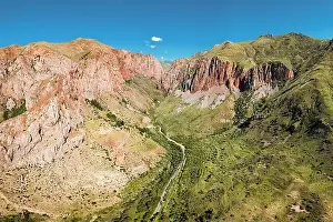 Armenia Prints: Aerial drone view over an epic gorge in a river valley with red geological rocks