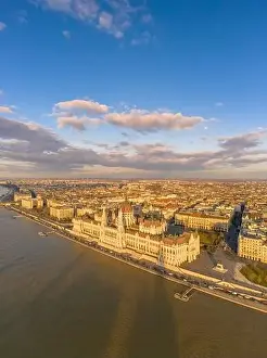 Kossuth Square Prints: Aerial drone view of Hungarian Parliament by Danube river in Budapest sunset hour