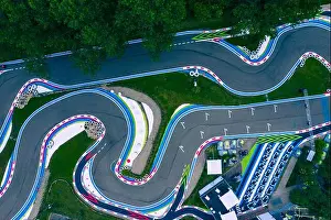Racer Prints: Aerial drone view of a kart racing in the forest, view from above