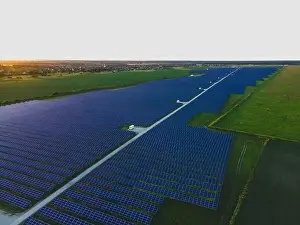 48mp Prints: Aerial drone view of large solar panels at a solar farm at bright summer sunset