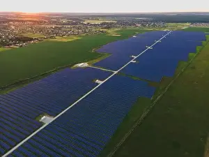 48mp Prints: Aerial drone view of large solar panels at a solar farm at bright summer sunset