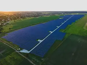 48mp Prints: Aerial drone view of large solar panels at a solar farm at bright summer sunset