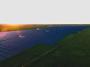 48mp Prints: Aerial drone view of large solar panels at a solar farm at bright summer sunset