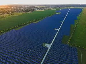 48mp Prints: Aerial drone view of large solar panels at a solar farm at bright summer sunset