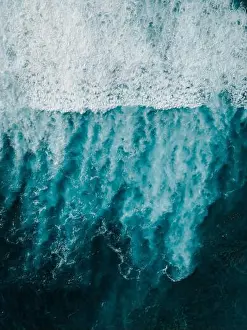 White Water Prints: Aerial drone view looking straight down at breaking ocean waves and white sea foam on deep turquoise water