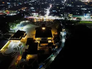 Tower Park Prints: Aerial drone view of Monument Gedung Juang is one of historical building in Tambun at night