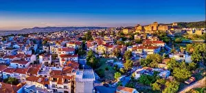 Aerial drone view of old Byzantine castle and the famous city of Thessaloniki or Salonica at sunset, North Greece