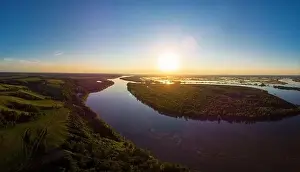 Bulk Prints: Aerial drone view of river landscape in sunny summer sunset