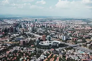 From above aerial drone view shot of city with dense infrastructure in Madrid, Spain