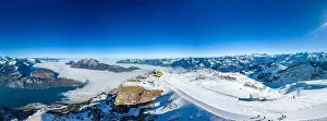 Stoos Prints: Aerial drone view of snow covered mountains and ski slopes, ski area Stoos, Switzerland